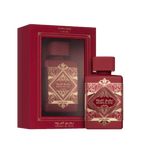 Lattafa Bade'e Al Oud Sublime apa de parfum, flacon frontal rosu cu detalii aurii prezentat intr-un decor de lux.