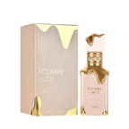 Lattafa  Eclaire apa de parfum, flacon frontal roz-crem pudrat cu detalii aurii fluide.