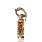 Detaliu flacon Lattafa Sehr Al Lattafa apa de parfum, evidențiind ornamentul dragon și piatra roșie decorativă.